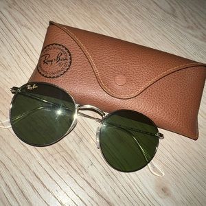 Womens silver round frame sunglasses. Green lenses